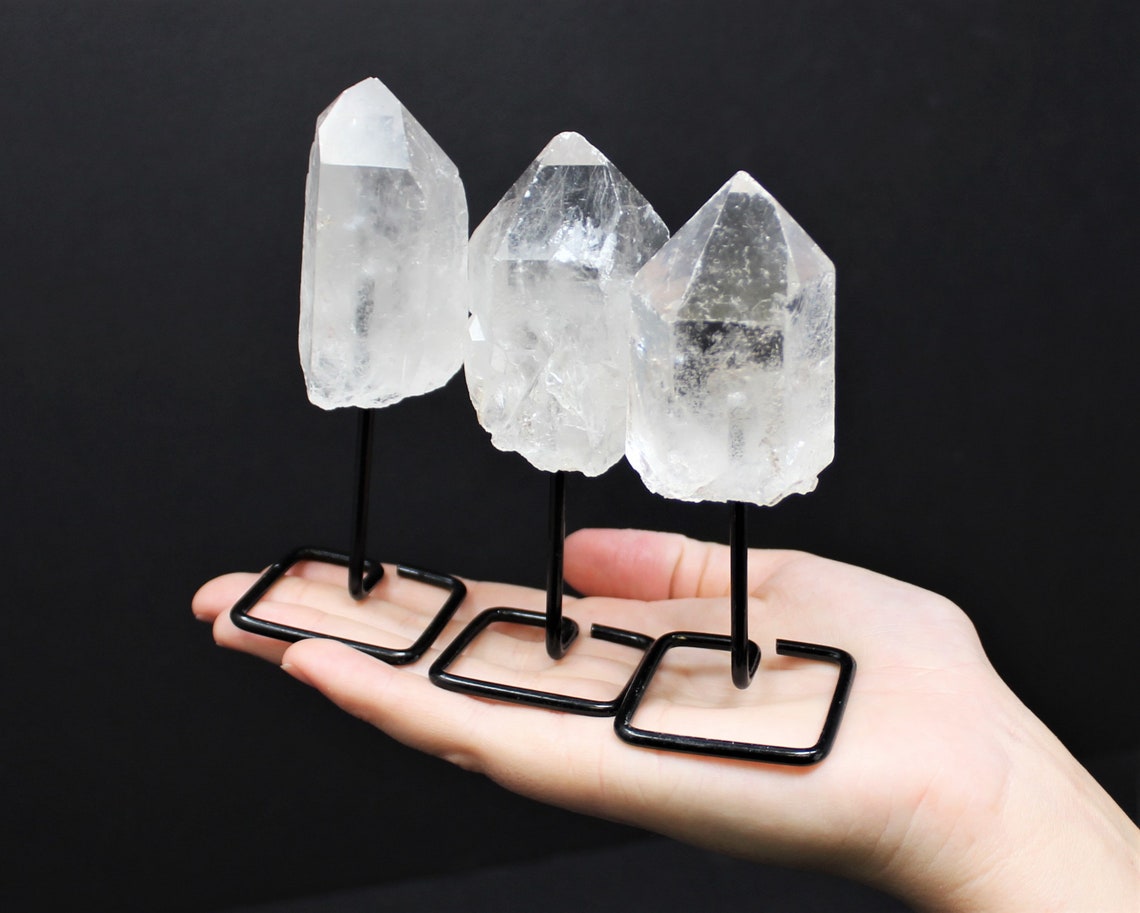 Clear Quartz Point On Metal Stand