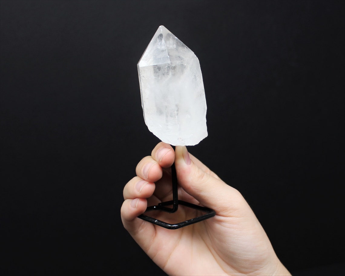 Clear Quartz Point On Metal Stand