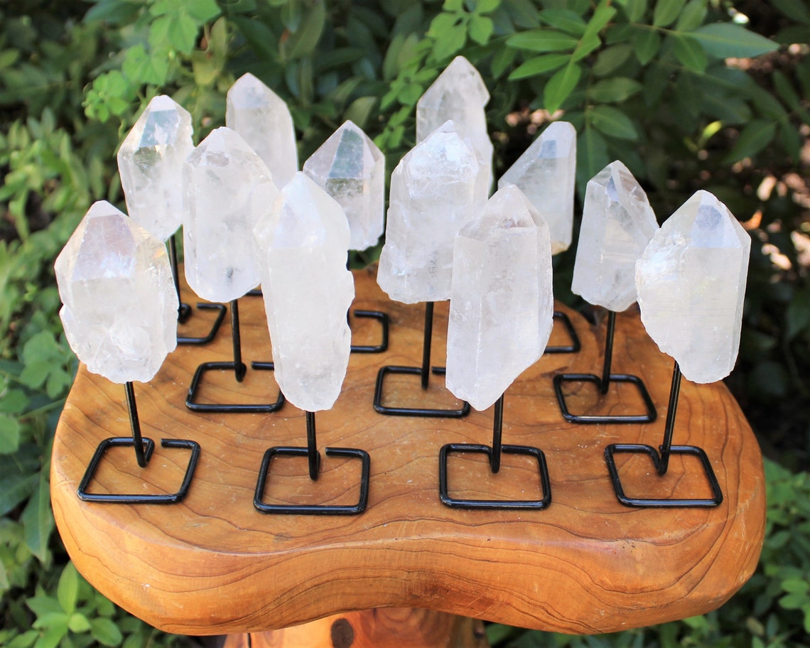 Clear Quartz Point On Metal Stand