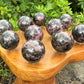 Rhodonite Crystal Sphere With Stand