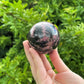 Rhodonite Crystal Sphere With Stand