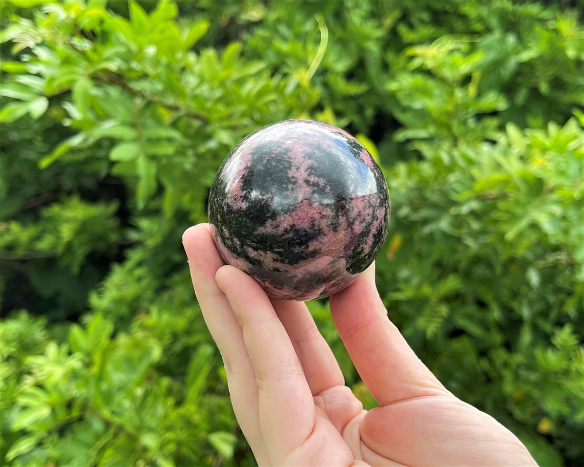 Rhodonite Crystal Sphere With Stand