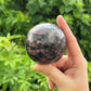 Rhodonite Crystal Sphere With Stand